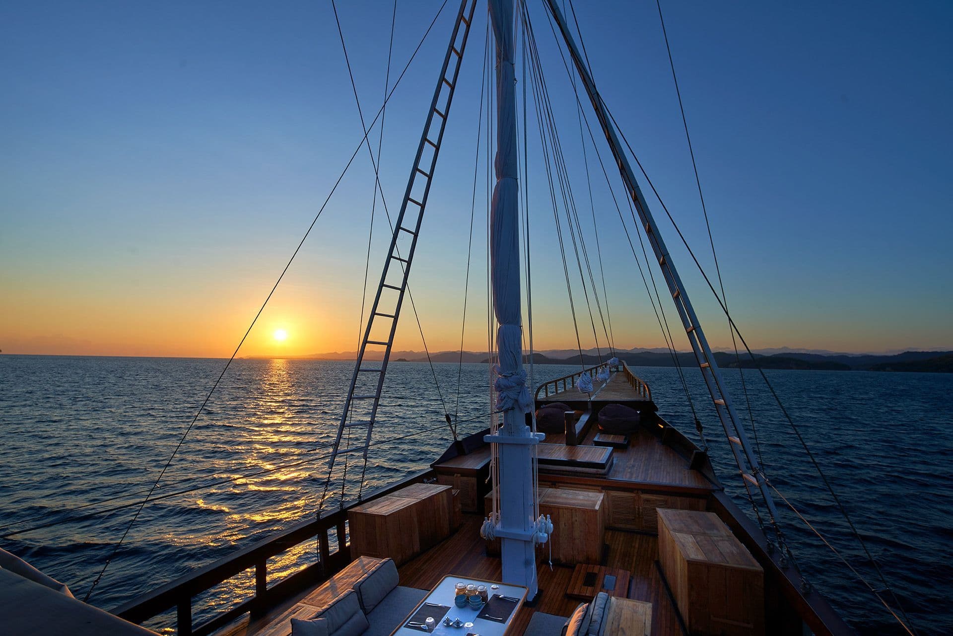 front deck at Oracle boat, blue sky, beautiful sunrise, wide ocean