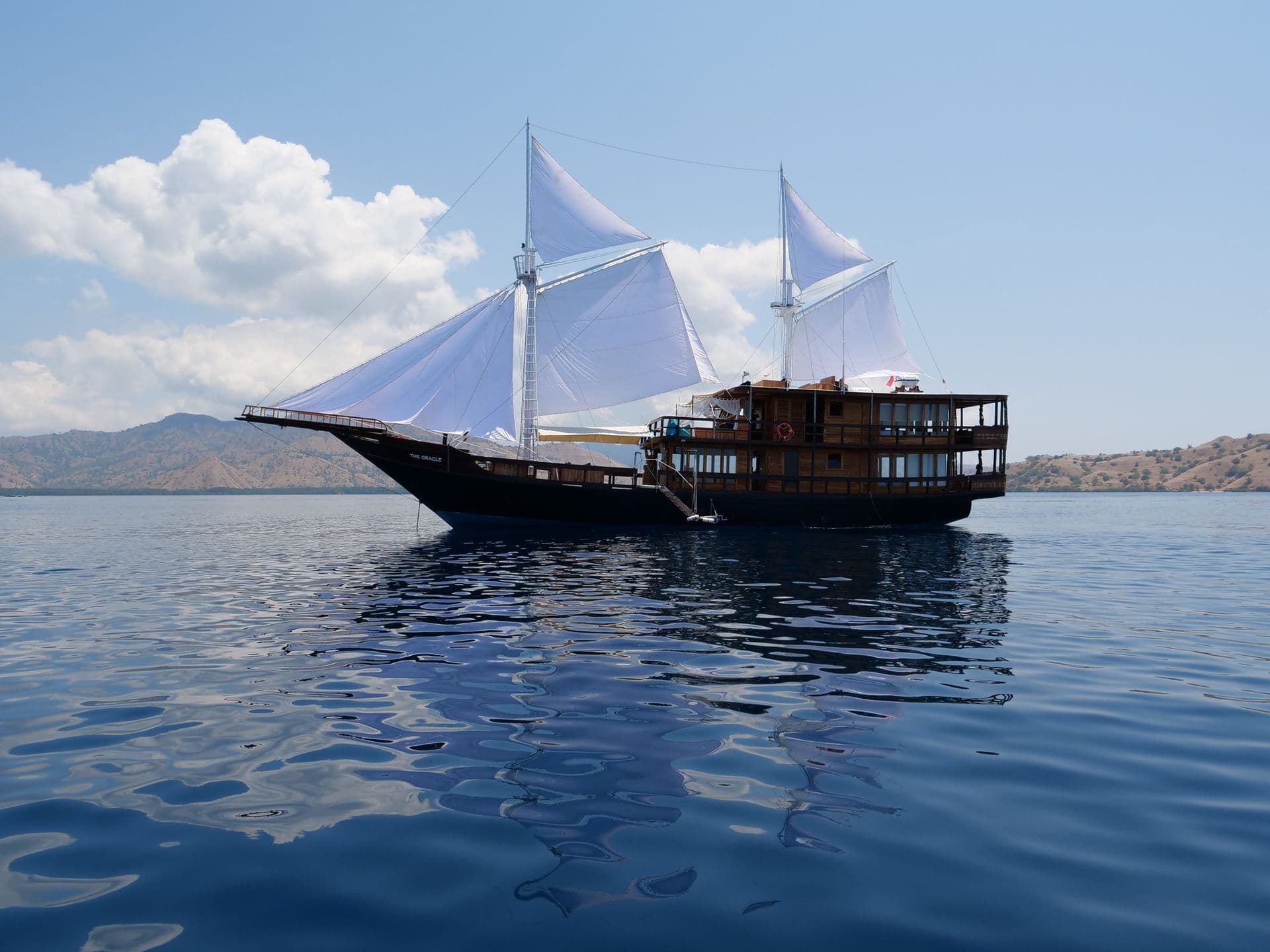 oracle boat landscape, bright sky, white cloud, blue sea water