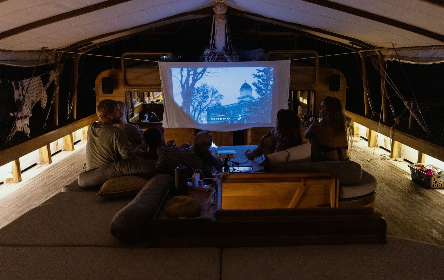 movie screen room, cozy sofa, four people enjoy the movie