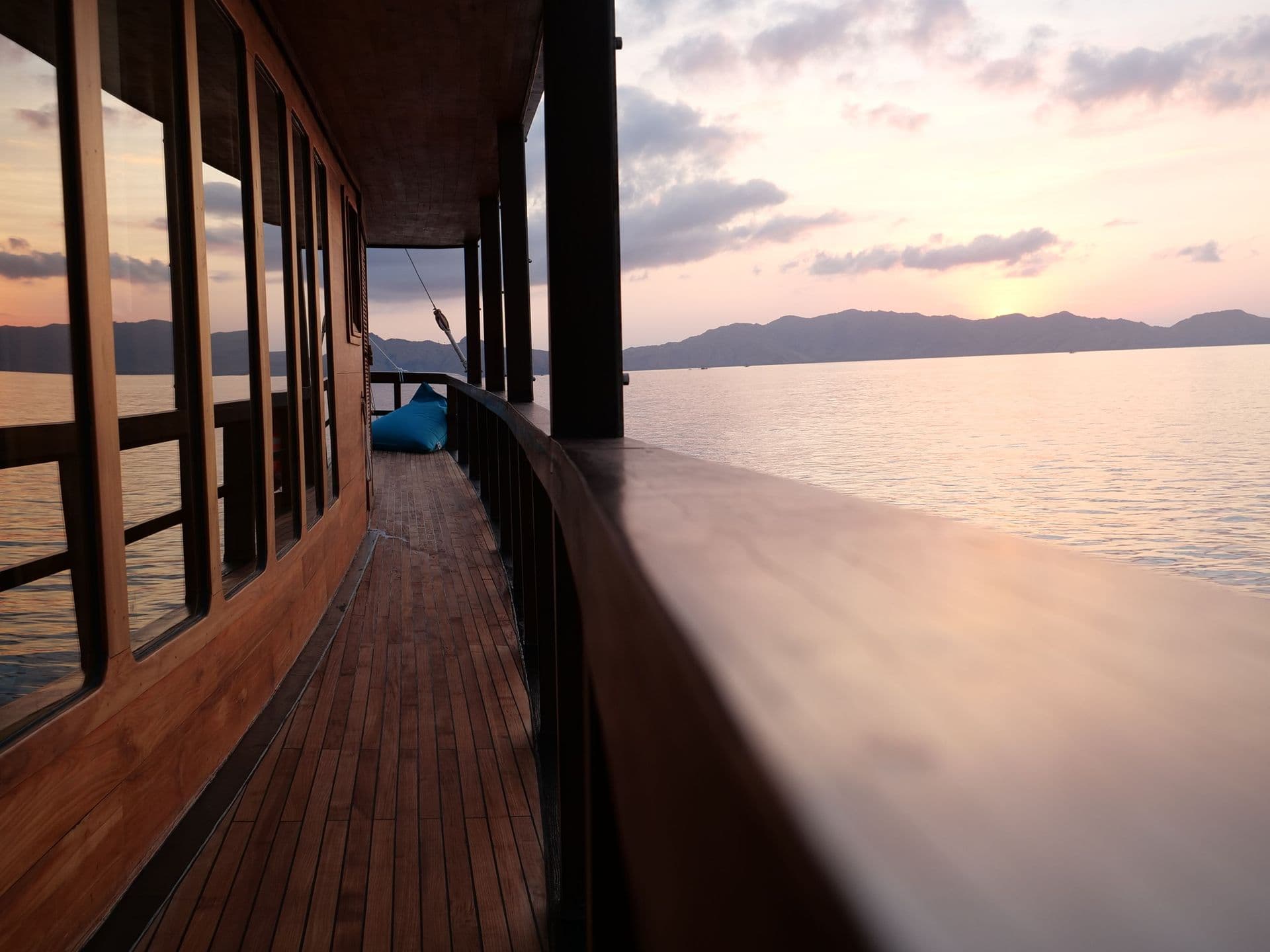 side balcony, the oracle boat, sunset view, wooden interior