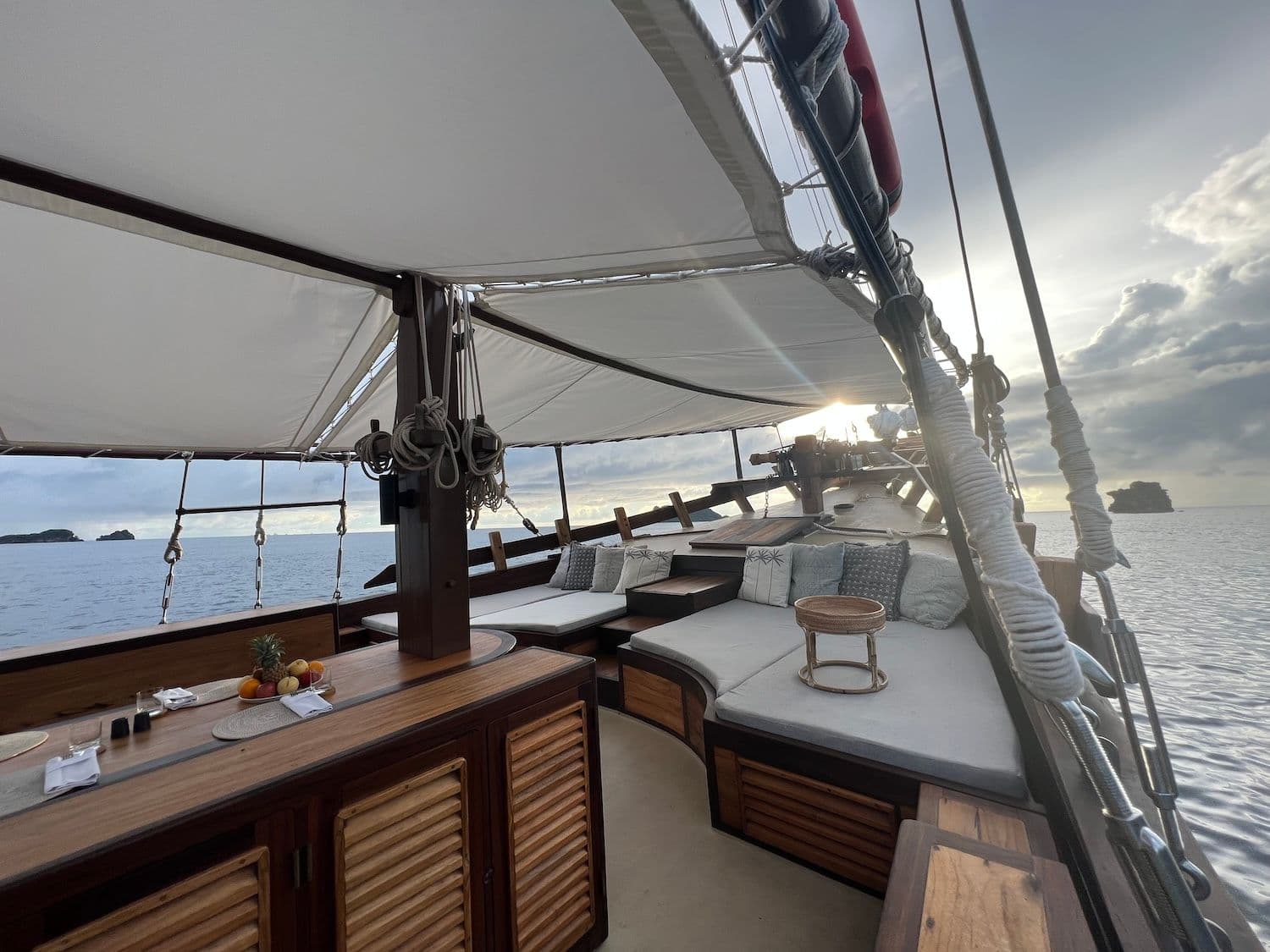 dewata top deck, white canopy, wooden interior