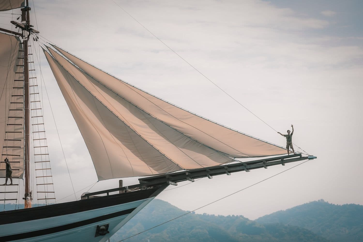 samasara samudra boat, white big sail, beautiful landscape on the background