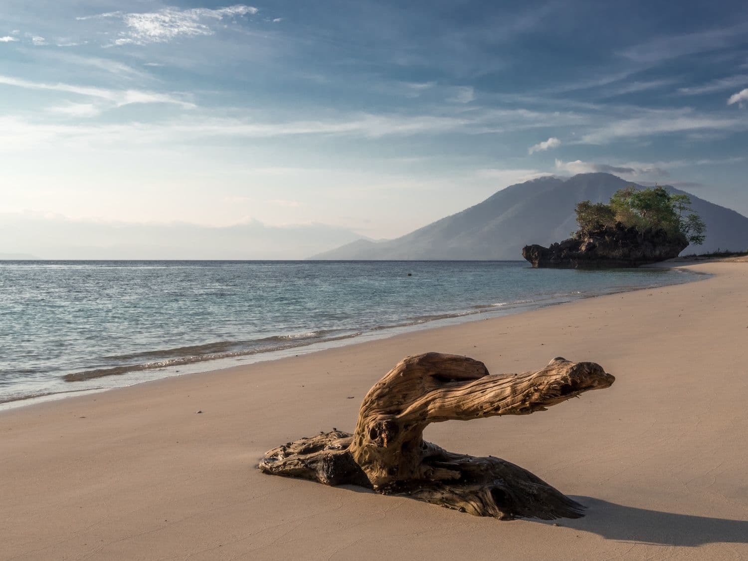 staright beach at Alor, beautiful beach, bright sky, mountain view on the background