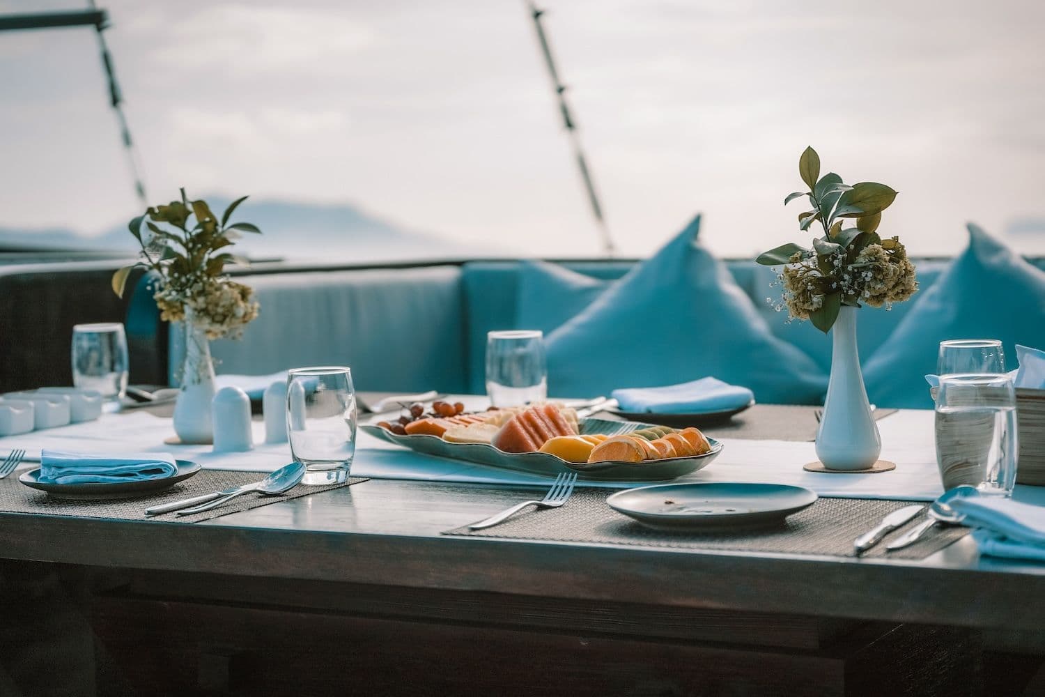 dining set, food on the table, blue sofa pillow