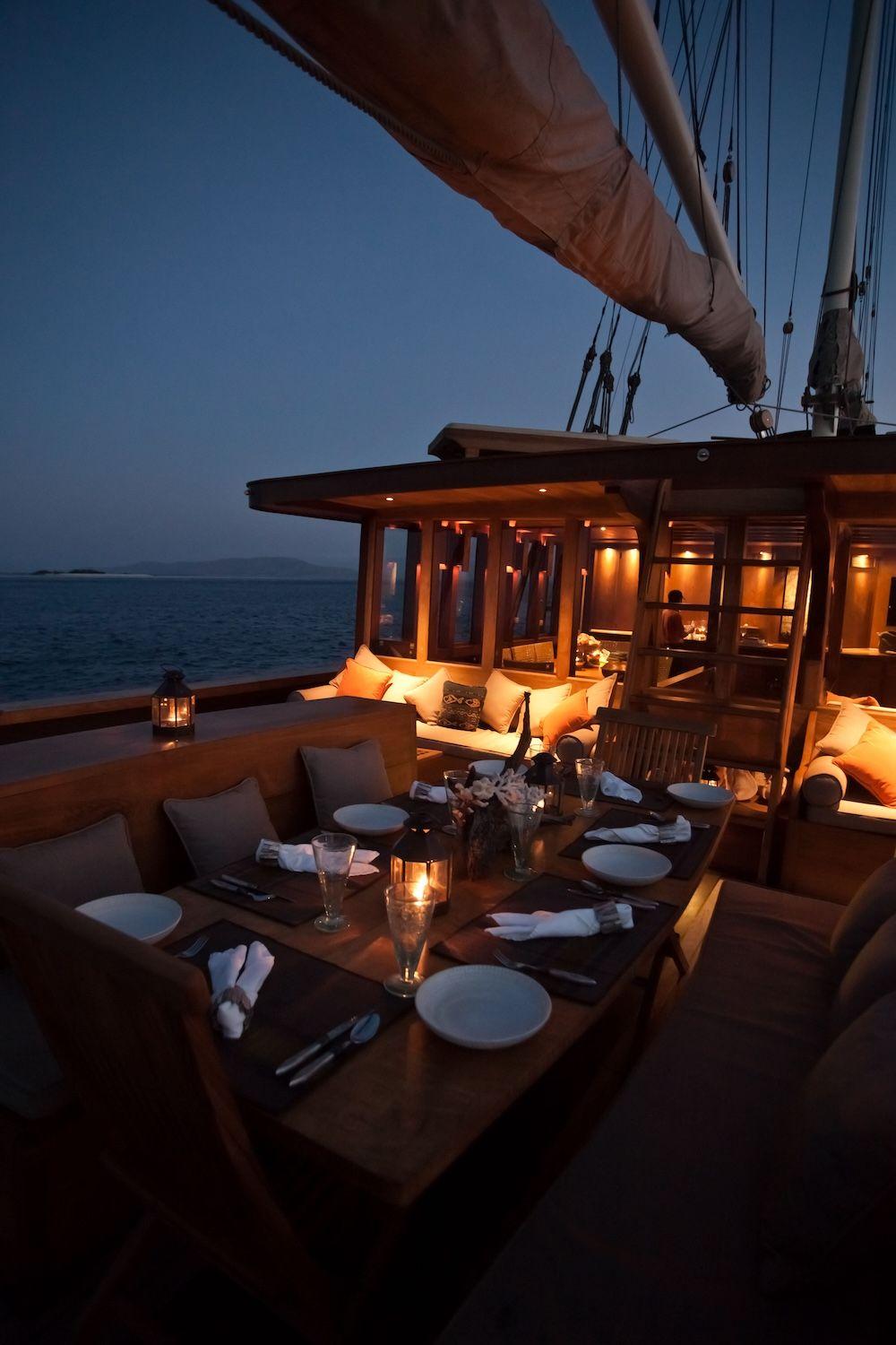 si datu bua boat with beautiful view, dining table, beautiful evening view, candle dinner