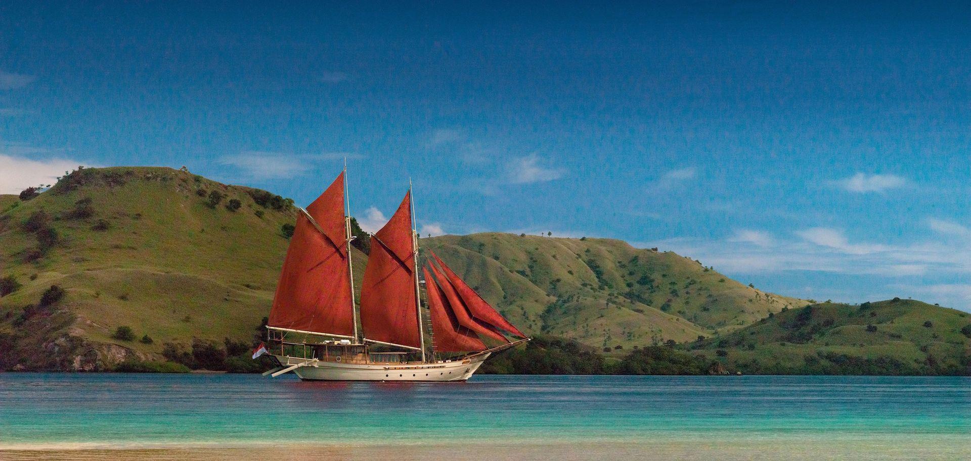 si datu bua boat with good panoramic view, blue sky, green hills