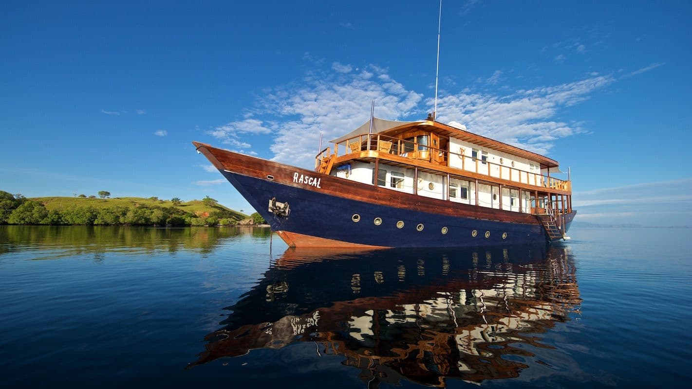 beautiful grand rascal boat, blue sky, blue color on boat, rascal boat landscape