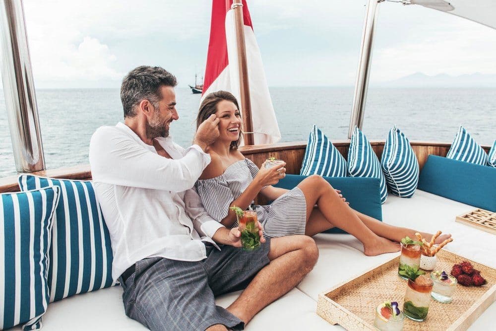 couple on the relaxing bench, Indonesia flag, blue pillows