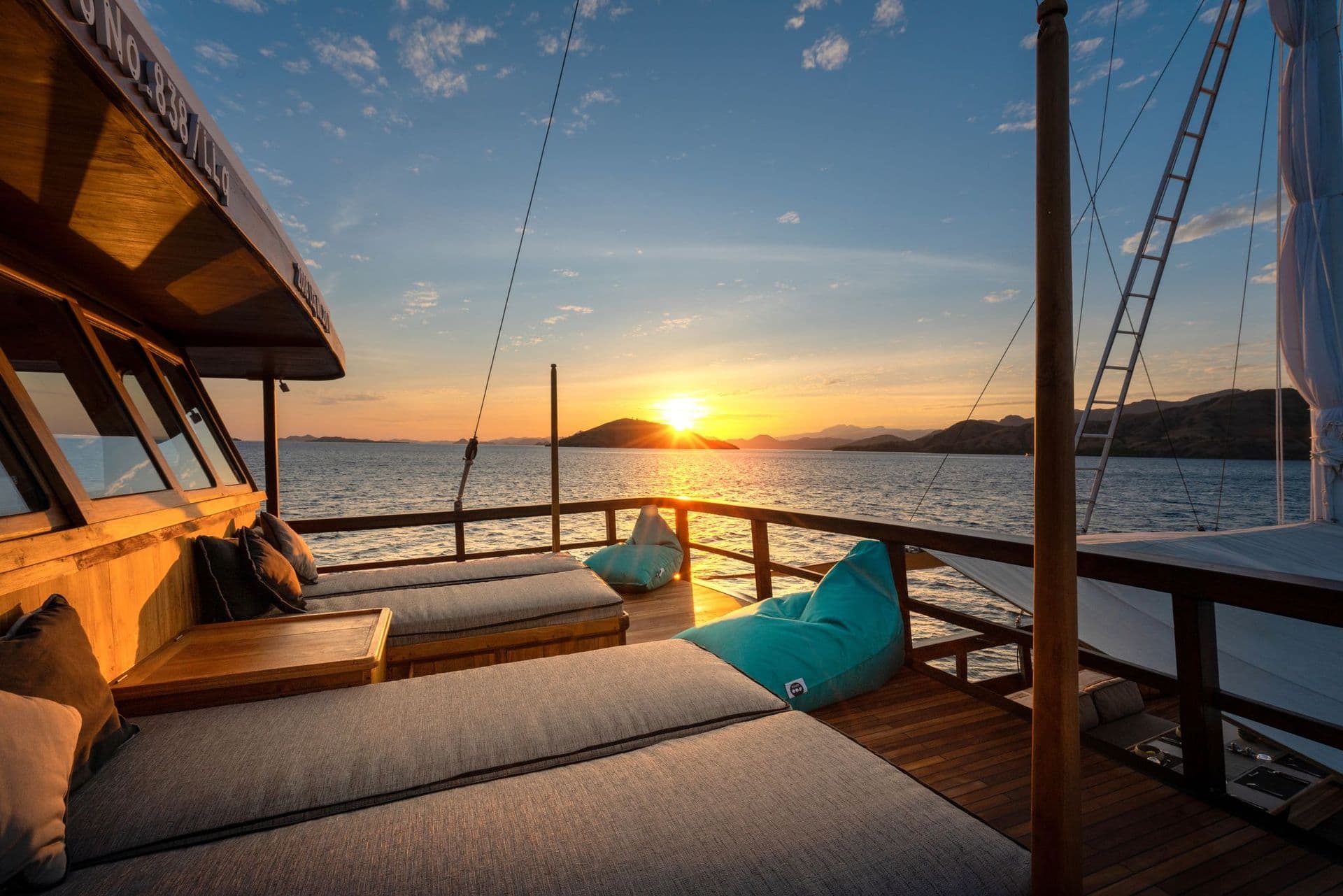 relax bench on the deck, sunrise, beautiful blue sky, turquoise beanbag