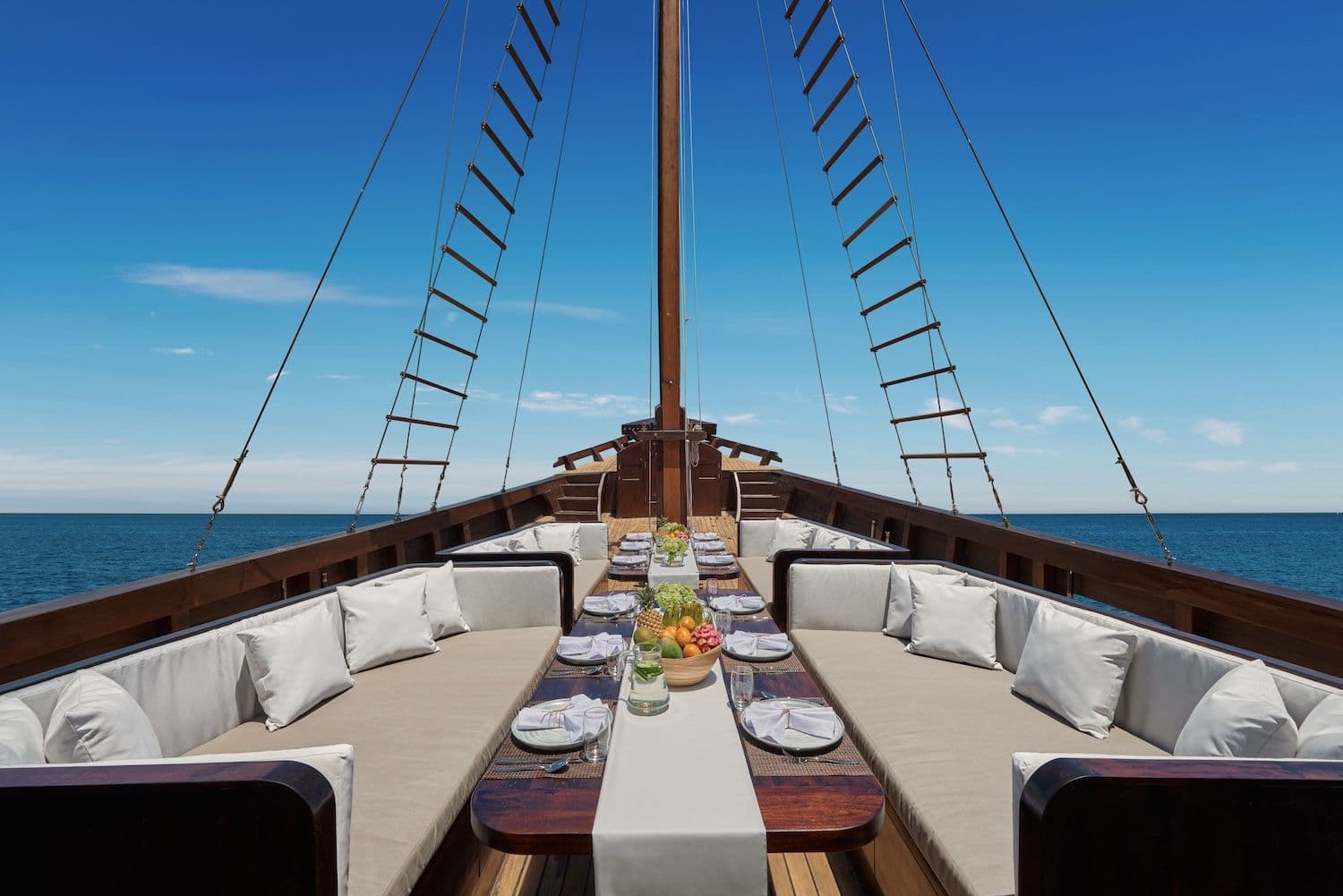 dining table setting on the main deck, blue sky view, grand sofa on the main deck